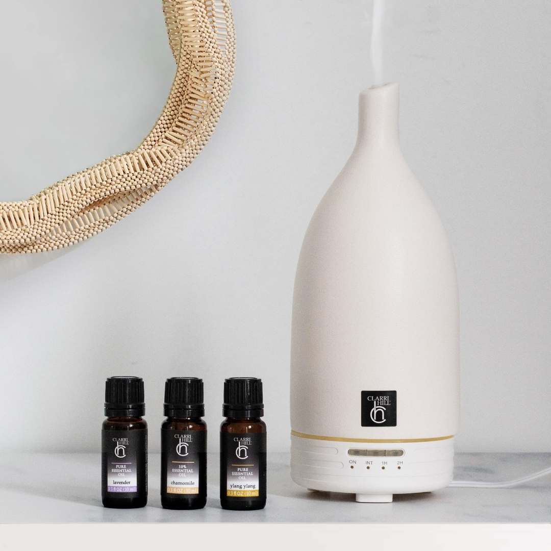 A photo of Clarri Hill's high-quality aroma diffuser and a collection of essential oils, designed to transform any room into a haven of peace and relaxation. Crafted with natural ingredients for a luxurious and eco-friendly experience.